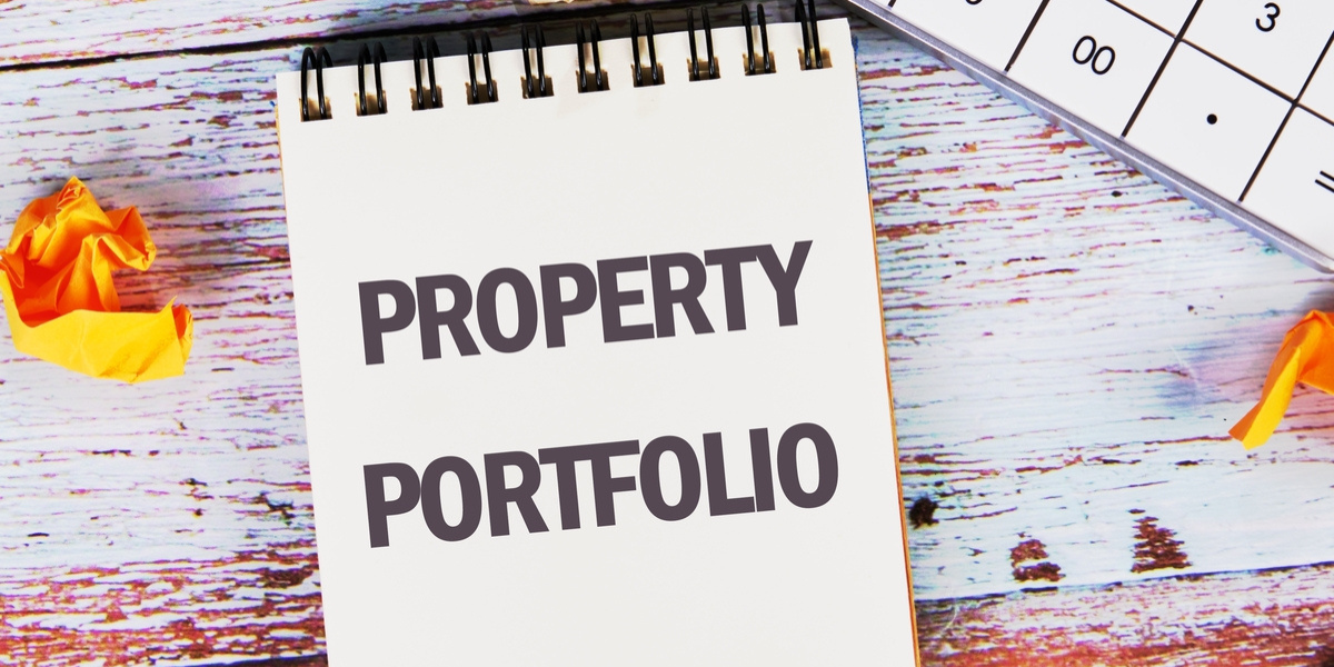 A notepad that says property portfolio